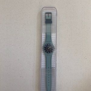 Swatch watch light blue band dark blue face